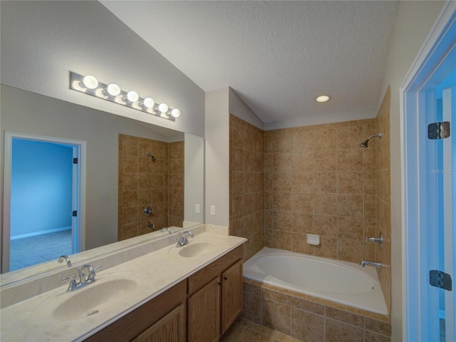 7462 Bentonshire Ave, Windermere, FL 34786 - bathroom featuring a textured ceiling, double vanity, tiled shower / bath, and recessed lighting