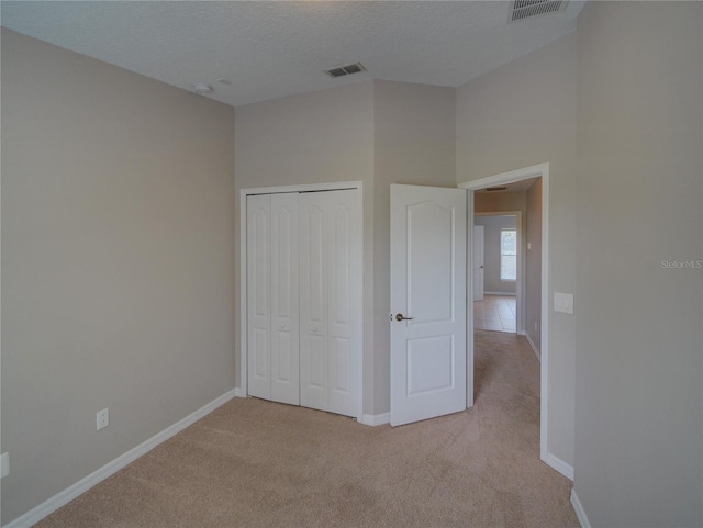 7462 Bentonshire Ave, Windermere, FL 34786 - unfurnished bedroom with carpet floors and a closet