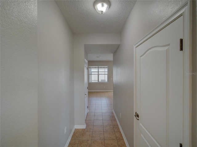 7462 Bentonshire Ave, Windermere, FL 34786 - hallway with light tile patterned flooring and a textured ceiling