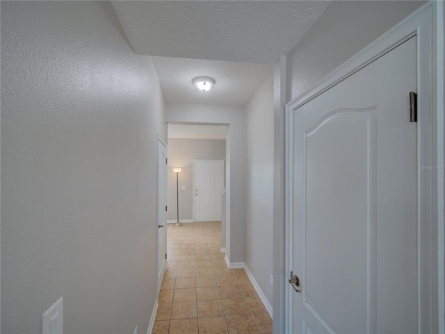 7462 Bentonshire Ave, Windermere, FL 34786 - hallway with a textured ceiling and light tile patterned floors