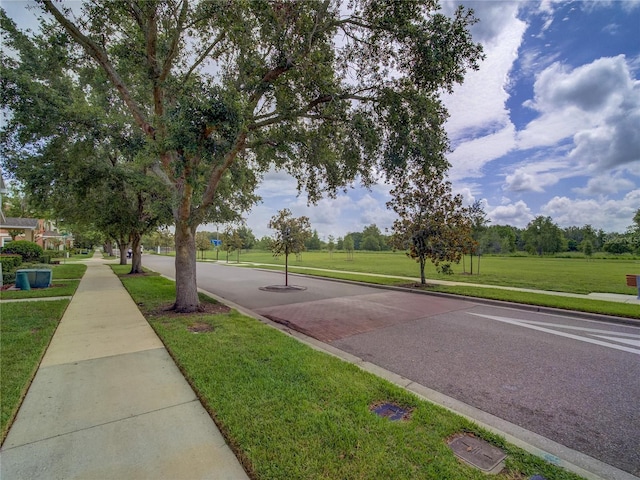 7462 Bentonshire Ave, Windermere, FL 34786 - view of asphalt road featuring sidewalks and curbs