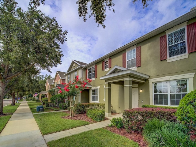 7462 Bentonshire Ave, Windermere, FL 34786 - view of front of property with stucco siding and a front lawn