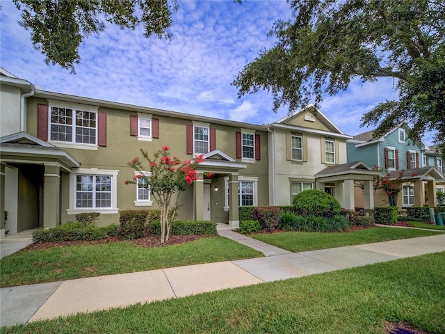 7462 Bentonshire Ave, Windermere, FL 34786 - view of property with stucco siding and a front yard