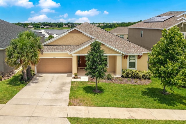 1593 Osprey View Dr, Apopka, FL 32703 - craftsman house featuring an attached garage, roof with shingles, concrete driveway, a front lawn, and stucco siding