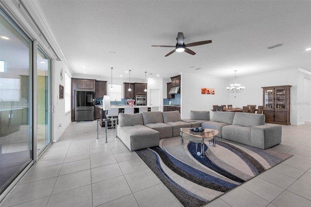 1593 Osprey View Dr, Apopka, FL 32703 - living area with light tile patterned flooring, crown molding, a chandelier, a ceiling fan, and healthy amount of natural light