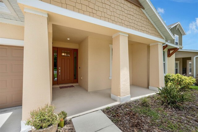 1593 Osprey View Dr, Apopka, FL 32703 - property entrance with stucco siding
