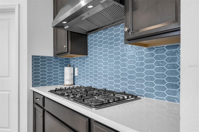 1593 Osprey View Dr, Apopka, FL 32703 - kitchen with range hood, stainless steel gas stovetop, light countertops, and backsplash