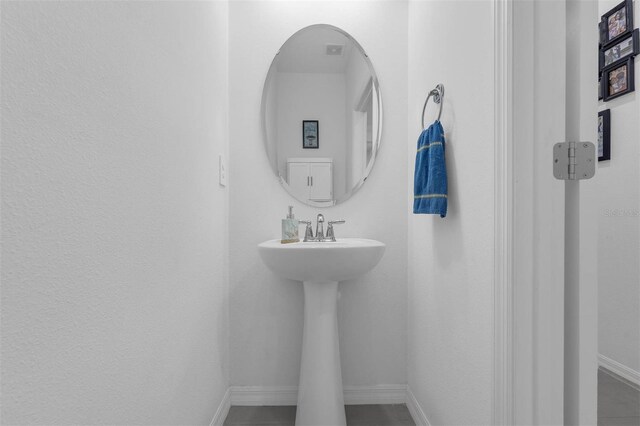 1593 Osprey View Dr, Apopka, FL 32703 - bathroom featuring baseboards