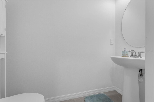1593 Osprey View Dr, Apopka, FL 32703 - bathroom featuring baseboards and toilet