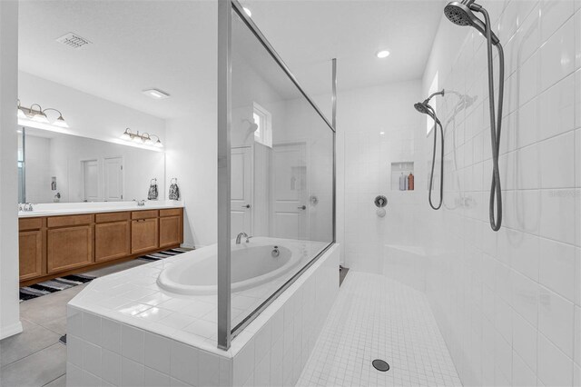 1593 Osprey View Dr, Apopka, FL 32703 - bathroom featuring a bath, a walk in shower, double vanity, and tile patterned flooring