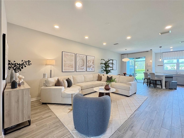4171 Via Sienna Cir, Sarasota, FL 34243 - living area with light wood-style floors and recessed lighting
