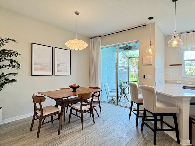 4171 Via Sienna Cir, Sarasota, FL 34243 - dining room with light wood-style flooring