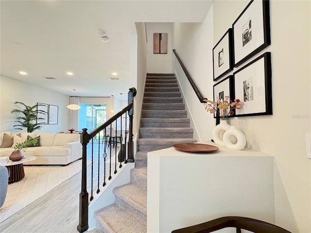 4171 Via Sienna Cir, Sarasota, FL 34243 - stairway with recessed lighting and wood finished floors