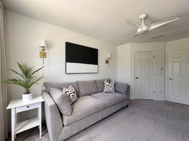 4171 Via Sienna Cir, Sarasota, FL 34243 - carpeted living area with a ceiling fan and a textured ceiling