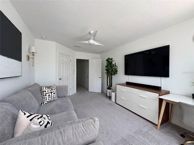 4171 Via Sienna Cir, Sarasota, FL 34243 - carpeted living room featuring a textured ceiling and ceiling fan
