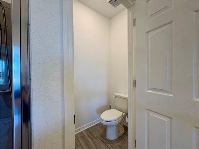 4171 Via Sienna Cir, Sarasota, FL 34243 - bathroom with wood finished floors and toilet