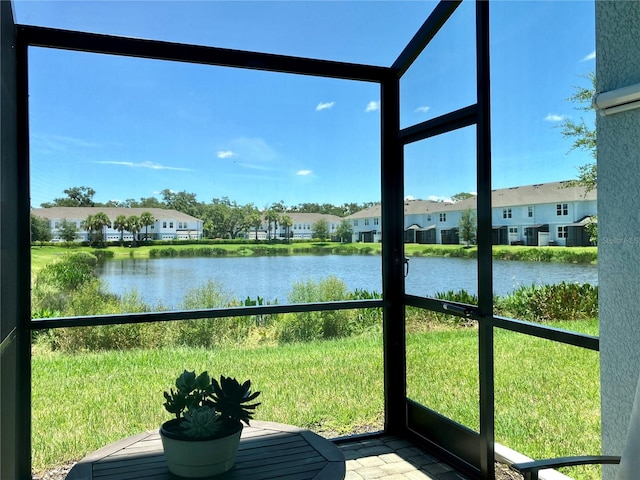 4171 Via Sienna Cir, Sarasota, FL 34243 - sunroom featuring a water view and a residential view