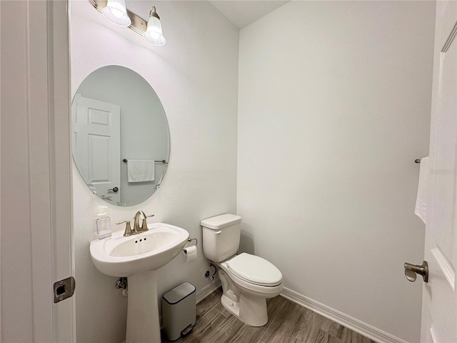4171 Via Sienna Cir, Sarasota, FL 34243 - bathroom with wood finished floors and toilet