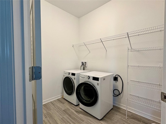 4171 Via Sienna Cir, Sarasota, FL 34243 - washroom featuring washer and dryer and light wood-style floors