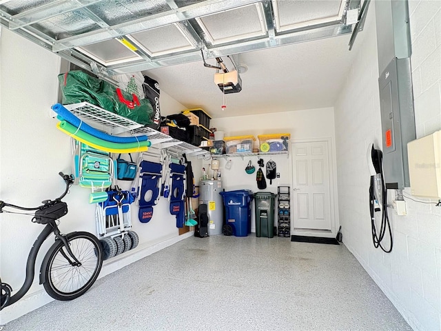 4171 Via Sienna Cir, Sarasota, FL 34243 - garage featuring water heater, a garage door opener, and concrete block wall
