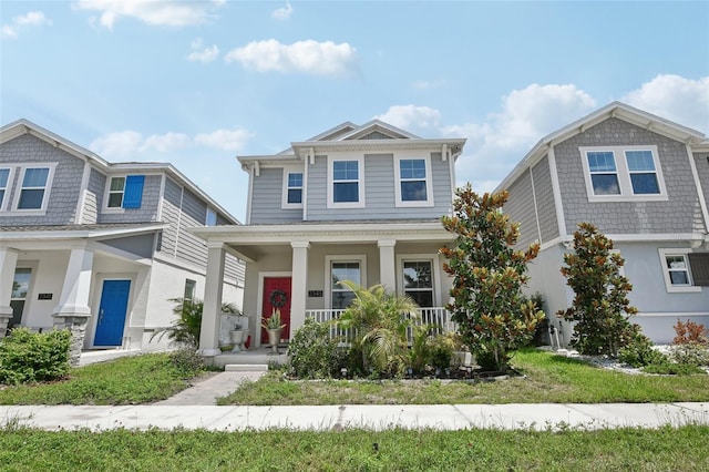 2345 Volunteer Ave, Kissimmee, FL 34744 - view of front facade with a porch