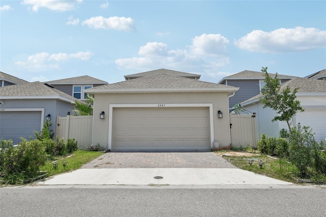 2345 Volunteer Ave, Kissimmee, FL 34744 - view of front of home featuring stucco siding and driveway