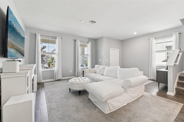 2345 Volunteer Ave, Kissimmee, FL 34744 - living area with wood finished floors, recessed lighting, and a textured ceiling