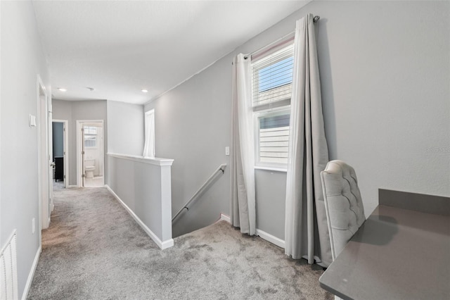 2345 Volunteer Ave, Kissimmee, FL 34744 - hallway featuring an upstairs landing, carpet flooring, and recessed lighting