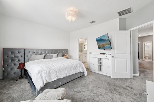 2345 Volunteer Ave, Kissimmee, FL 34744 - carpeted bedroom with ensuite bath