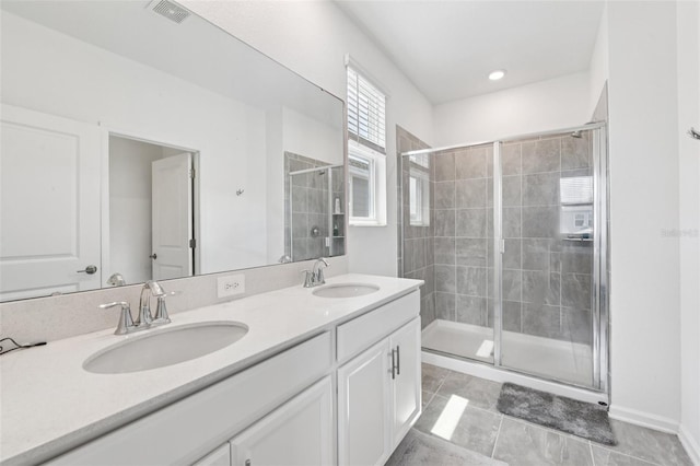 2345 Volunteer Ave, Kissimmee, FL 34744 - bathroom with a shower stall, double vanity, and tile patterned floors