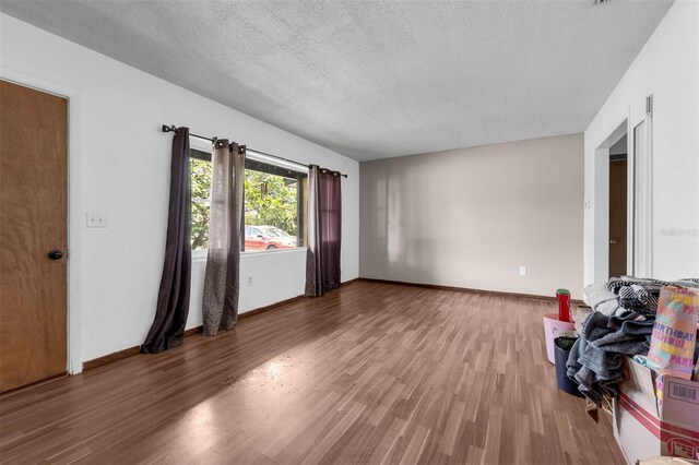 905 Flewelling Ave, Ocoee, FL 34761 - unfurnished room featuring wood finished floors and a textured ceiling