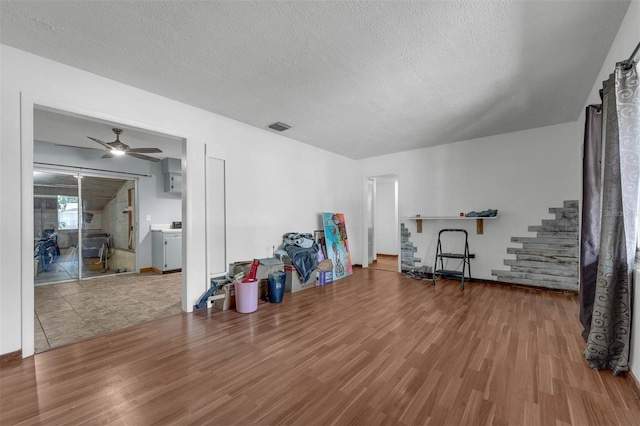 905 Flewelling Ave, Ocoee, FL 34761 - interior space with wood finished floors, stairs, a textured ceiling, and ceiling fan