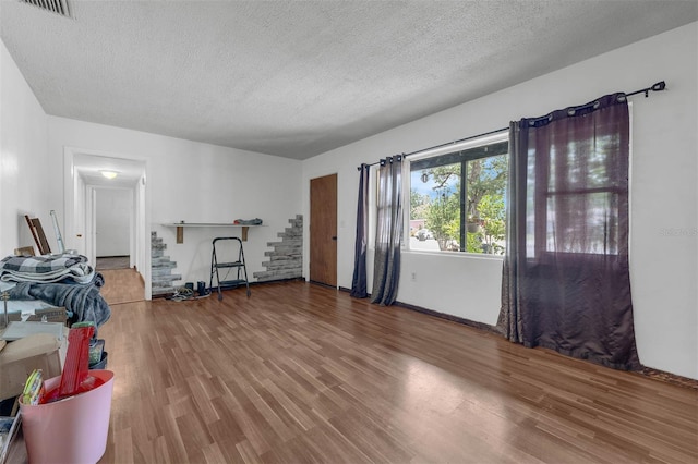 905 Flewelling Ave, Ocoee, FL 34761 - workout area with a textured ceiling and wood finished floors