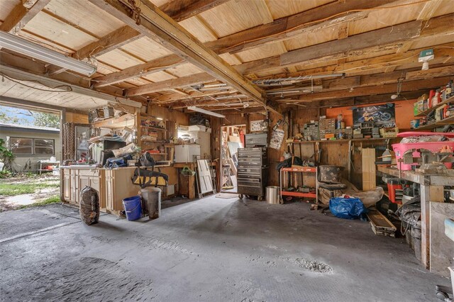 905 Flewelling Ave, Ocoee, FL 34761 - garage featuring a workshop area