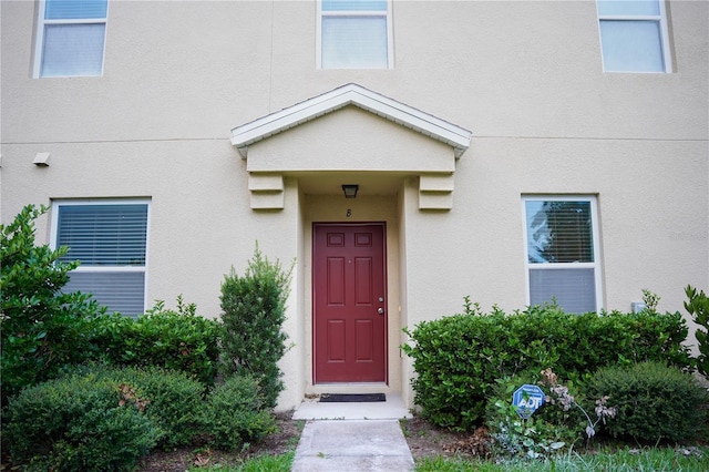3569 Seneca Club Loop Unit 13, Orlando, FL 32808 - view of exterior entry with stucco siding