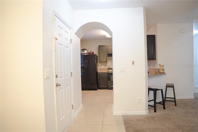 3569 Seneca Club Loop Unit 13, Orlando, FL 32808 - hall featuring arched walkways and light tile patterned floors