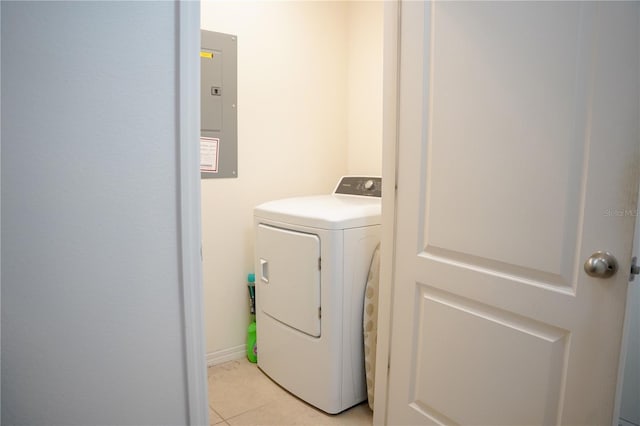3569 Seneca Club Loop Unit 13, Orlando, FL 32808 - laundry area with washer / clothes dryer, electric panel, and light tile patterned flooring