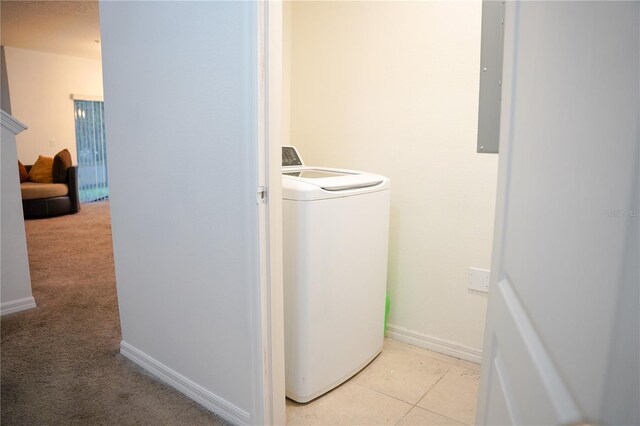 3569 Seneca Club Loop Unit 13, Orlando, FL 32808 - laundry area with washer / dryer, light carpet, and electric panel
