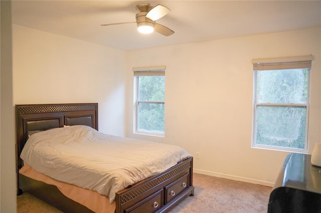 3569 Seneca Club Loop Unit 13, Orlando, FL 32808 - bedroom featuring carpet floors and ceiling fan