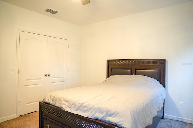 3569 Seneca Club Loop Unit 13, Orlando, FL 32808 - bedroom with light carpet, a closet, and ceiling fan
