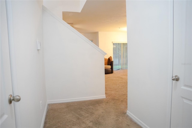 3569 Seneca Club Loop Unit 13, Orlando, FL 32808 - hallway featuring carpet and stairs