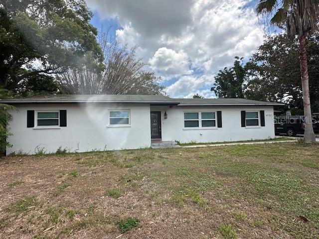 4732 Luce Rd, Lakeland, FL 33813 - single story home with stucco siding and a front lawn