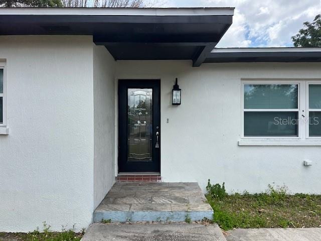 4732 Luce Rd, Lakeland, FL 33813 - view of exterior entry featuring stucco siding