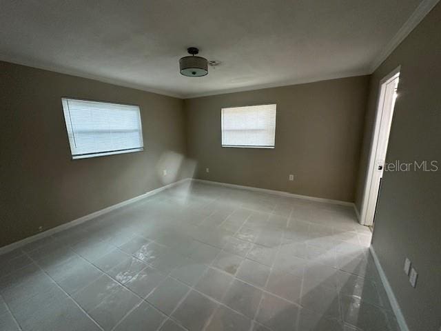 4732 Luce Rd, Lakeland, FL 33813 - empty room featuring ornamental molding and light tile patterned floors