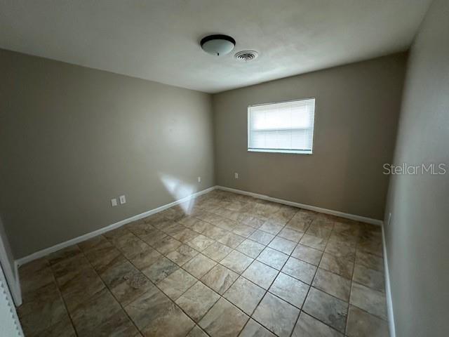 4732 Luce Rd, Lakeland, FL 33813 - spare room with baseboards