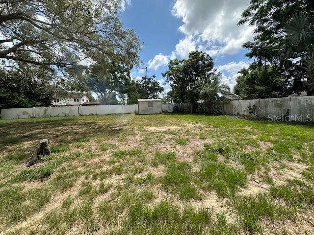 4732 Luce Rd, Lakeland, FL 33813 - fenced backyard featuring a shed