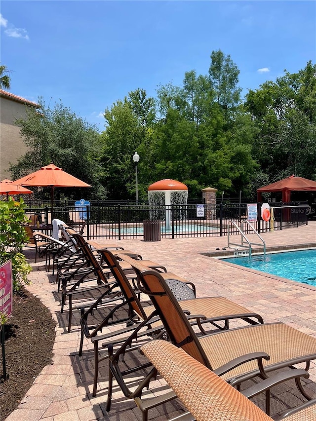 8010 Tuscany Way Unit 3102, Davenport, FL 33896 - community pool with a patio area