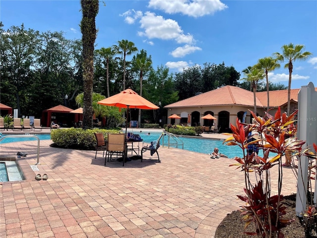 8010 Tuscany Way Unit 3102, Davenport, FL 33896 - community pool featuring a patio