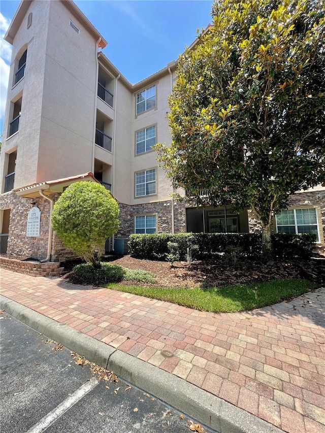 8010 Tuscany Way Unit 3102, Davenport, FL 33896 - view of property featuring uncovered parking