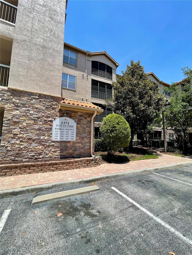 8010 Tuscany Way Unit 3102, Davenport, FL 33896 - view of building exterior featuring uncovered parking